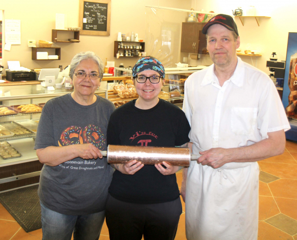 After 41 years Sharron and Ron Fikkert hand over the bakery rolling pin to Alannah Moody (middle) who has purchased the Boissevain Bakery. Moody will temporarily close next week for some renovations, and will re-open under a new name, Boissevain Bakeshop.