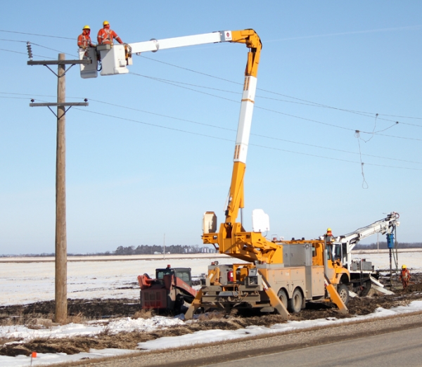 Hydro crews were hard at work on Tuesday, March 27 replacing old poles on #10 highway, north of Minto. The work is part of an upgrade system, which includes updating stations in Minto and Carroll.  