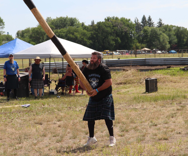 Shaun Ings competes in the caber toss at Deloraine Fair on July 26. 
