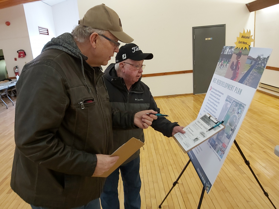 Larry Rainnie (left) and Greg Cameron discuss some of the items in the new Rec Development Plan for Boissevain-Morton. An open house was held for the public on March 16, in which the municipality apprised the community of their work on projects like the new swimming pool.   