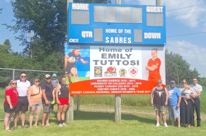 Emily Tuttosi and family were on hand to officially unveil the sign honouring her accomplishments at the big sign at the Sabres field in Souris. The homegrown rugby star has represented Canada at the World Cup, had a successful university career and played professionally in England. She will be an assistant coach with the Ottawa Gee Gees this year. (Photo right) Earlier in the spring, a smaller sign was put up outside of Souris.