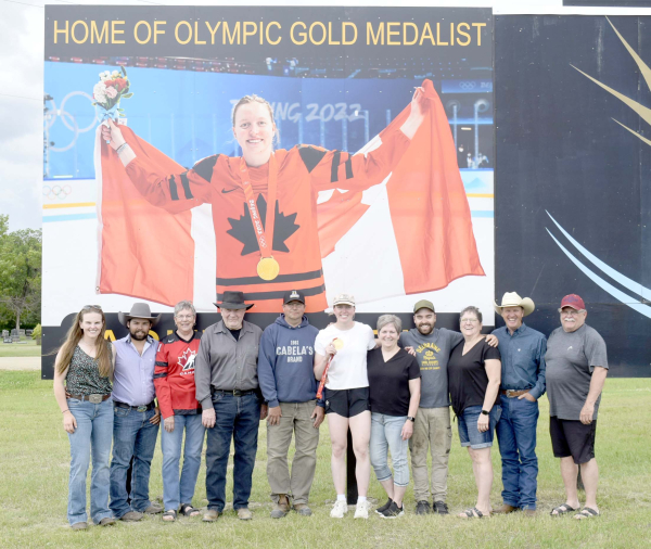 Hockey star Ashton Bell (left) signs an autograph for Elizabeth Munro. The Deloraine native, an Olympic gold medal winner and member of the professional Ottawa women’s team, was honoured with two signs in her hometown. As well as being a major figure on the ice, Bell has also kept her connection to Deloraine, including organizing the annual Don Dietrich Memorial Road Hockey Tournament to help raise money for minor sports in the community.