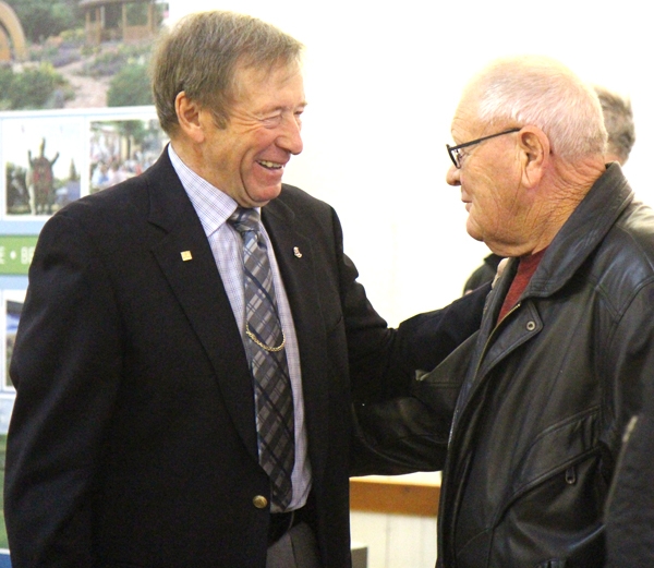John Dyck (right) congratulates Ed Anderson on his retirement at a celebration tea held on December 7 at the Legion Hall.