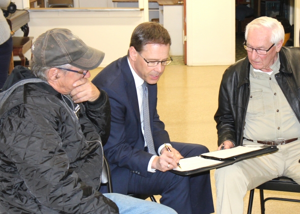 Consultant Gordon Daman (middle) goes over some details of the assisted living project with Lonnie Graham (left) and Bill Ransom. Daman was at the public meeting on Sunday, October 20 to discuss the details of the upcoming seniors’ housing facility to be located beside the Boissevain Health Centre.  