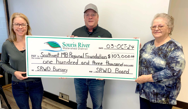 October 3, 2024 was a red-letter day for the Southwest Manitoba Regional Foundation. A donation of $103,000 from Souris River Watershed District (SRWD) put the foundation’s principal over one million dollars. The funds from SRWD will be held in trust and used for bursaries for students located within the district, and who are attending university or college in the fields of agriculture or natural resources. The bursaries will be available in 2025. (L-R): Dana Kelm, Secretary-Treasurer at SWMRF, Dean Brooker, manger at SRWD and Donna Todd, outgoing Chair/Director at SWMRF.