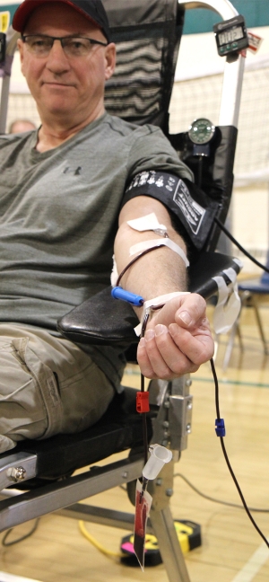 Ed Facey donates blood at the mobile donor clinic in Boissevain on March 14.