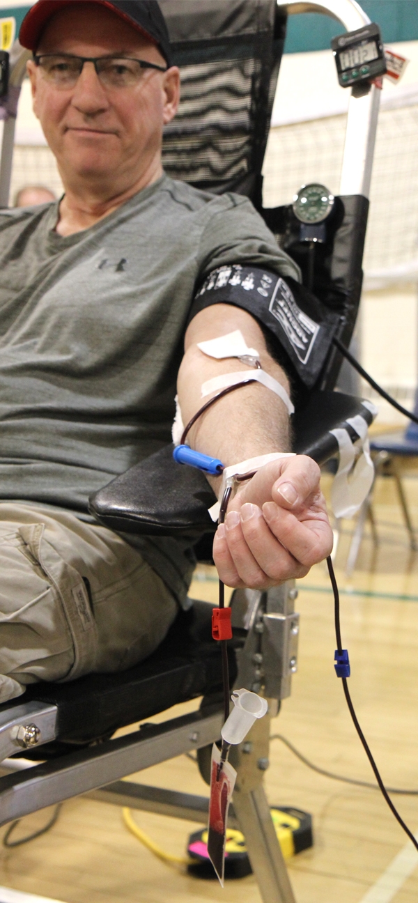 Ed Facey donates blood at the mobile donor clinic in Boissevain on March 14.